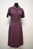 A 1940s navy blue and red checked wool day dress, having buttons to front and side metal zip, medium