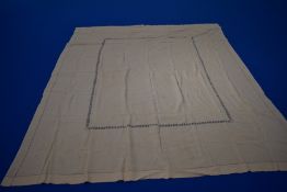 A 19th century cream bed cover, having highly decorative embroidery and drawn thread work.