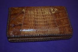 An early 20th century crocodile skin wallet.