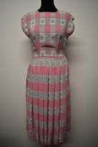 A 1950s St Michaels pleated patterned cotton sundress, having button fastening to both shoulders and