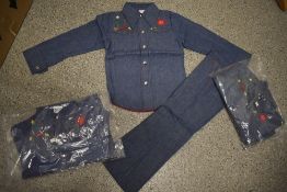 Three vintage 1970s childrens denim two piece outfits, new in packaging.