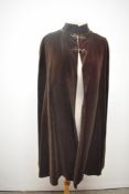 A 1950s 'Hildebrand' chestnut brown velvet cape, fully lined in taffeta.