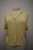 A 1940s pale yellow blouse, with pin tuck details to textured fabric, larger size.