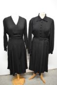 A late 30s/40s black patterned crepe dress, having v neckline and gathers to front of skirt and a