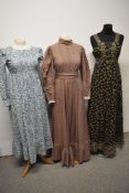 Three vintage dresses, including beige 1970s prairie style Laura Ashley maxi dress.