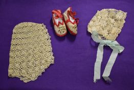 A ladies lace cap and a childs lace bonnet, both circa 1820's, sold with a pair of late Victorian
