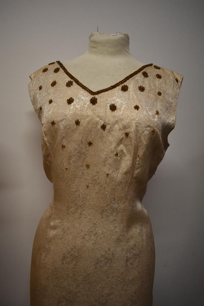 A 1950s buttermilk textured cotton day dress with tie detail to bodice, pleated skirt and cap - Image 2 of 7