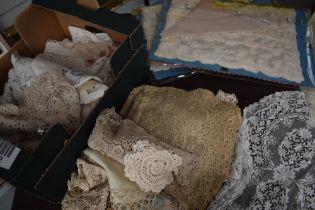 A mass of vintage and antique doyleys, including intricate worked lace and crochet examples.