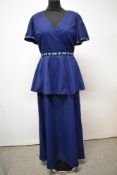 A 1960s maxi dress, having fluted sleeves and peplum waist, with Peterson Maid label.