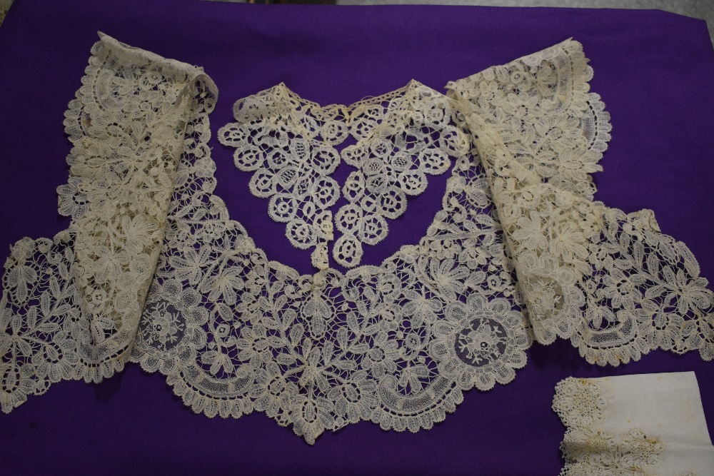 A Victorian lace collar and a similar smaller example, sold alongside and intricately edged