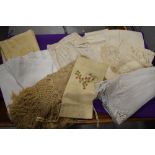 A selection of pieces of antique linen and similar, a hand embroidered draw string bag and a fringed