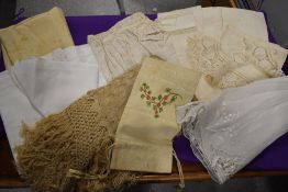 A selection of pieces of antique linen and similar, a hand embroidered draw string bag and a fringed