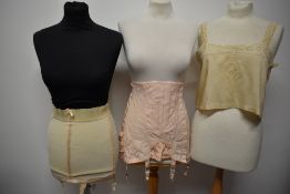 Two vintage girdles, one roll on and the other boned and a 1920s silk camisole.