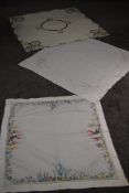 Three beautifully detailed vintage table cloths, including linen with cut work and embroidery and