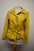 A ladies 1970s/ 80s yellow leather jacket.