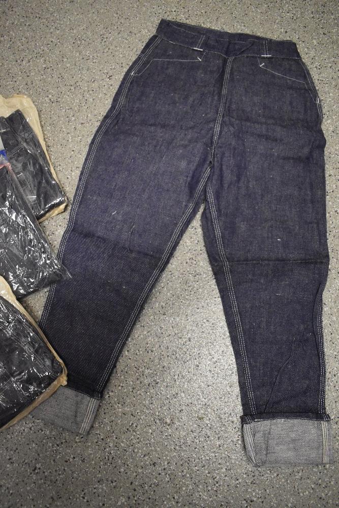 Four vintage 1960s pairs of teen/small adult denim jeans with turn ups, new in packaging. - Image 2 of 3