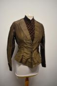 A Victorian brown silk bodice, with contrasting chestnut brown flocked cuffs, bid and pocket,
