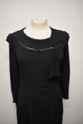 A 1930s black crepe bias cut day dress, having panelling to skirt, unusual triangular hatching to