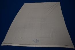 A French bed sheet, having blue embroidery, monogrammed 'L H' and ladder work to top, around a