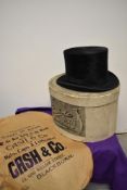 An early 20th century top hat, having 'Cash and Co, Blackburn' label, with box and paper advert.