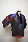 An early to mid 20th century Indo/ Chinese jacket, possibly Miao, jacket having extensive silk