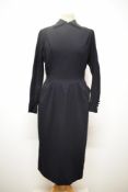 A really beautifully tailored 1950s navy blue textured wool day dress, having fitted bodice