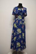 A bias cut 1930s floral day dress with liner, having shawl collar and bow detail to bodice.