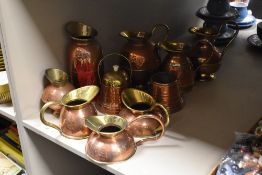 An assorted collection of early 20th Century copperware, by Peerage and others, including measures