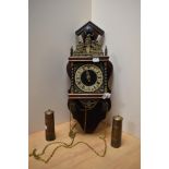 A mid-20th Century Dutch Atlas pendulum wall clock of Zaandam Zaanse style, measuring 50cm tall,