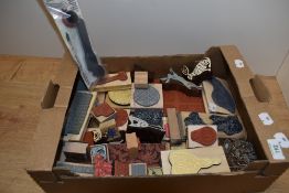 A box of vintage printing blocks depicting animals and objects