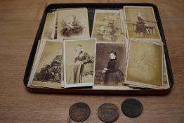 A tray of Victorian photographic prints and coins
