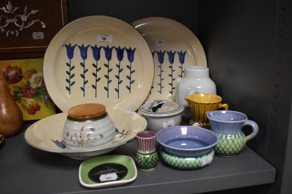 A selection of hand painted Scottish Lunaware plates and a bowl, a condiment jar and a selection