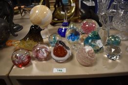 An assorted collection of art glass ornaments and paperweights, including a Teign Valley glass