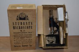 A vintage boxed Students Microscope manufacured by Signalling Equipment Limited