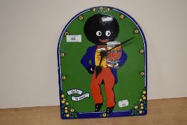 A hand painted porcelain enamel clock, having Robertson's golden shred marmalade figure to centre.