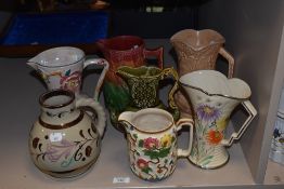 A Greys Pottery Lustre jug and a selection of other decorative jugs, including Indian Tree