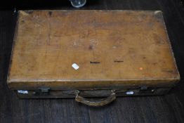 A vintage brown stitched leather suitcase, measuring 35cm x 60cm x 15cm