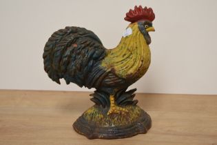 A cast metal cockerel door stop.