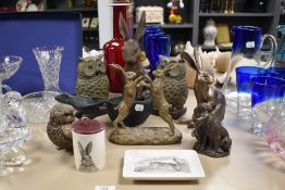 A pair of bronze effect owl bookends, a decorative hare ornament, and other similar animal