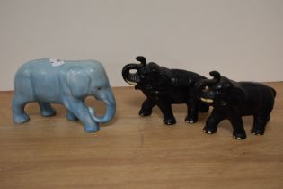 Three mid century ceramic elephants, including blue elephant in the style of Sylvac.