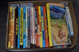 A collection of vintage children's annuals, including Blue Peter, Laurel & Hardy, The Dandy, Basil