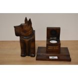 A 1930s treen Scotty dog wall pocket and a teak ink well 'From the teak of HMS Iron Duke Admiral