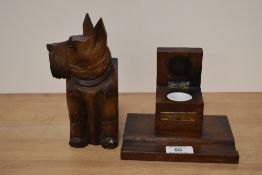 A 1930s treen Scotty dog wall pocket and a teak ink well 'From the teak of HMS Iron Duke Admiral