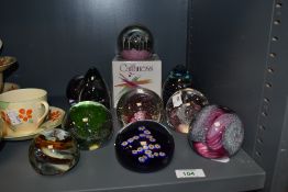 An assorted collection of art glass paperweights, by Liskeard, Caithness, Wedgwood, and Mdina