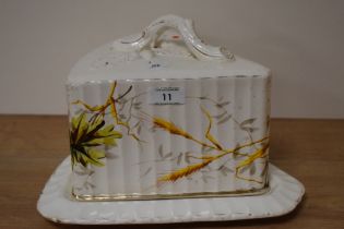 An early 20th century hand painted cheese dish, having foliate and wheat decoration, makers mark