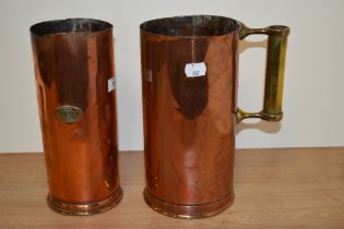 Two vintage former copped and brass fire extinguishers, having been converted to measuring vessels.