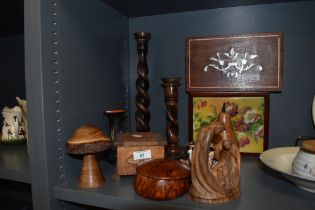 A selection of treen, including turned mushroom, carved figure, twist stem candlesticks and inlaid