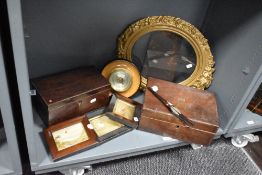 A French style gilt wood picture frame, a Georgian mahogany tea caddy, a later mahogany writing