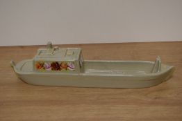 A ceramic tug, having hand painted floral detail and impressed with 1975 Middlewich.