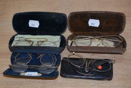A collection of antique Pince-nez and spectacles.